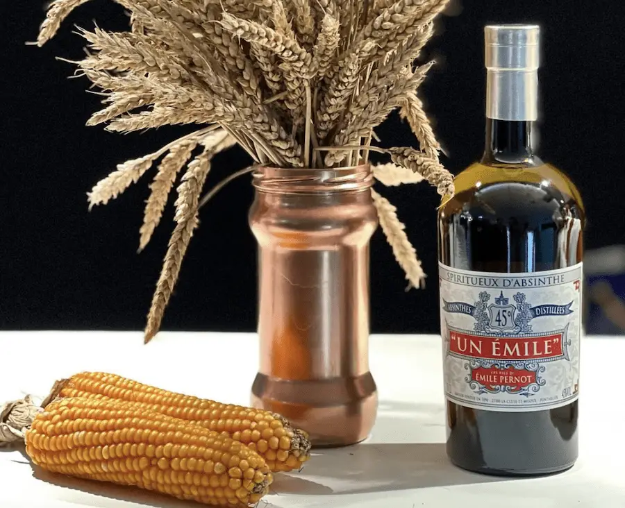 Absinthe Bottle with corn and wheat beside